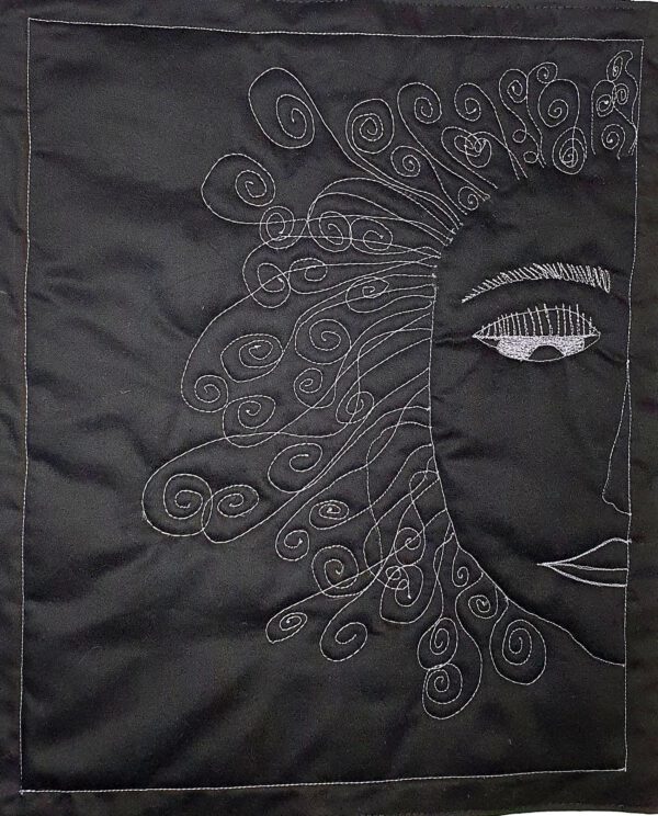 Mini Quilted Wall Hanging Free-Motion Embroidered Ethereal Face on a Black Background